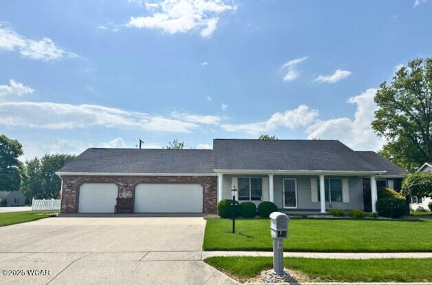 1461 Cessna Ave, Lima, OH 45807 - single story home featuring concrete driveway, a garage, and a front yard