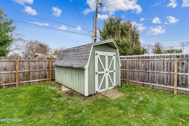 view of shed with a fenced backyard