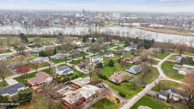 drone / aerial view featuring a water view and a residential view