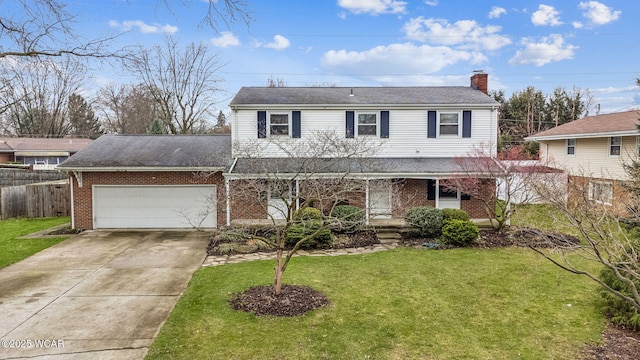 traditional-style home with a front lawn, brick siding, an attached garage, a chimney, and driveway