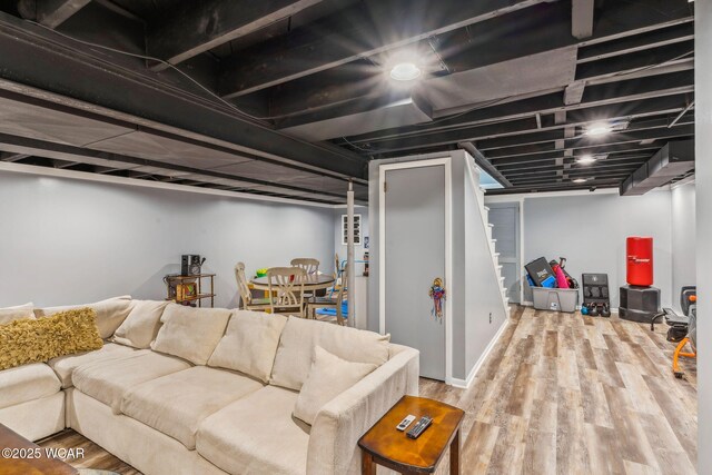 finished below grade area with stairway and wood finished floors