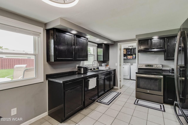 236 Lincoln Dr, Celina, OH 45822 - kitchen featuring black appliances, washer and clothes dryer, dark cabinets, and a sink