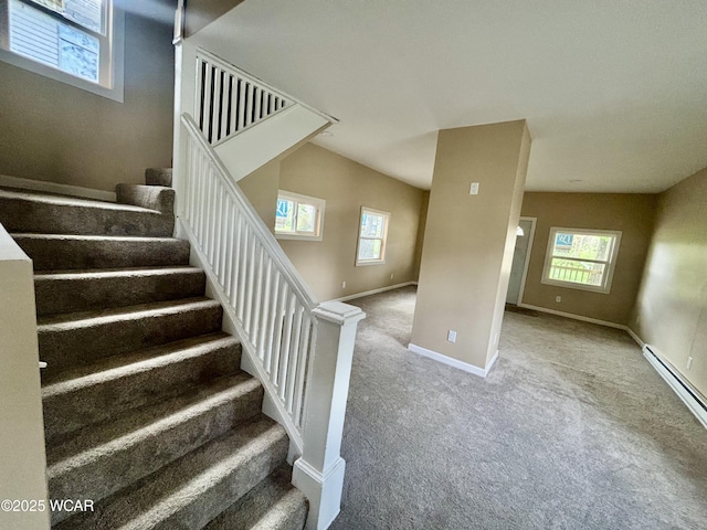 514 Fairview Ave, Lima, OH 45804 - stairway featuring a healthy amount of sunlight, carpet floors, a baseboard radiator, and baseboards