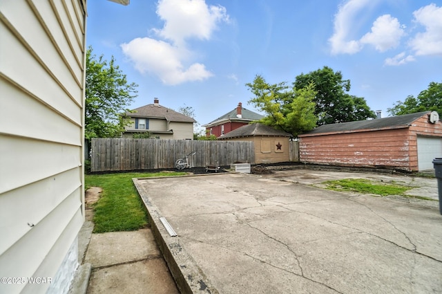 517 Marian Ave, Lima, OH 45801 - view of patio featuring a storage shed