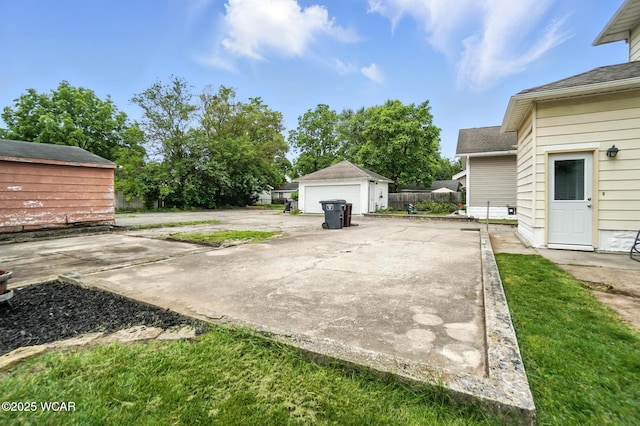 517 Marian Ave, Lima, OH 45801 - view of patio featuring an outbuilding and a detached garage