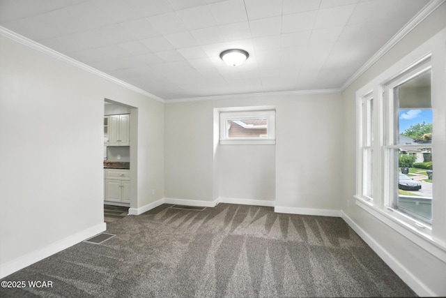 517 Marian Ave, Lima, OH 45801 - unfurnished room featuring dark colored carpet and ornamental molding