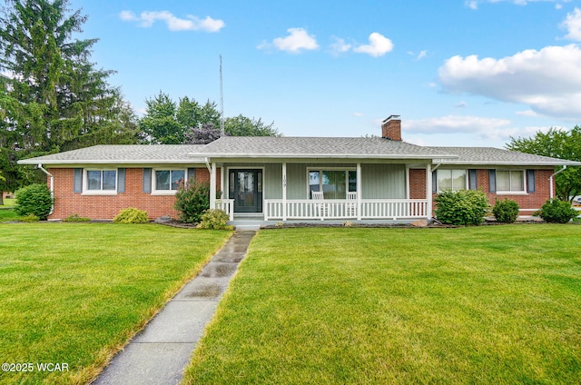 517 Marian Ave, Lima, OH 45801 - ranch-style home featuring a chimney, a porch, brick siding, and a front yard