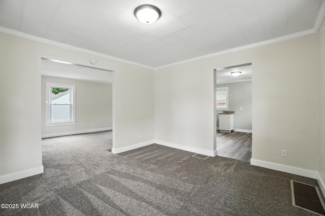517 Marian Ave, Lima, OH 45801 - unfurnished room featuring dark carpet, plenty of natural light, crown molding, and a smoke detector