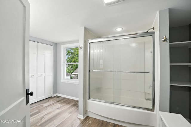 517 Marian Ave, Lima, OH 45801 - full bathroom with bath / shower combo with glass door and wood finished floors