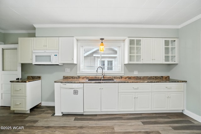 517 Marian Ave, Lima, OH 45801 - kitchen featuring white appliances, dark countertops, white cabinets, dark wood-style floors, and ornamental molding