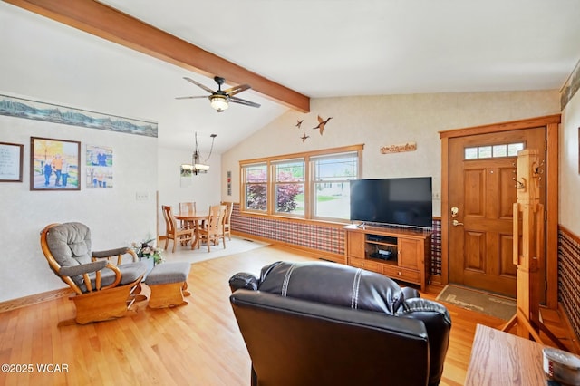 216 N Rauthland Ave, Wapakoneta, OH 45895 - living room with wood finished floors, a chandelier, and a ceiling fan