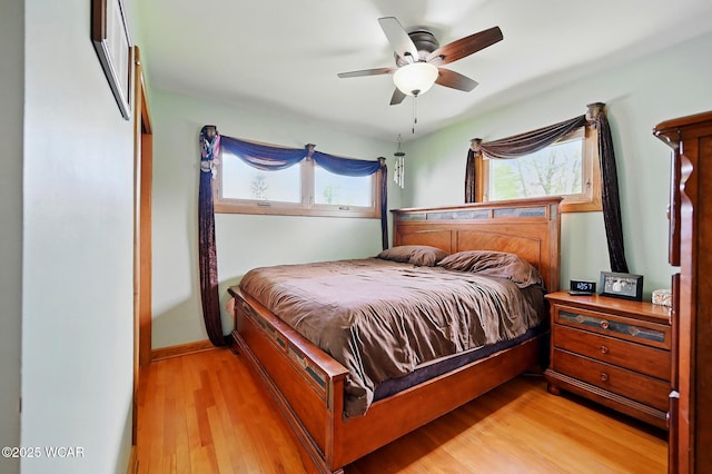 216 N Rauthland Ave, Wapakoneta, OH 45895 - bedroom featuring light wood-style flooring, a ceiling fan, and baseboards