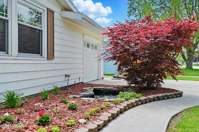 216 N Rauthland Ave, Wapakoneta, OH 45895 - view of home's exterior with an attached garage