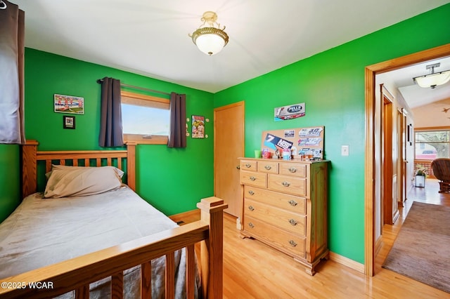 216 N Rauthland Ave, Wapakoneta, OH 45895 - bedroom with light wood finished floors and baseboards