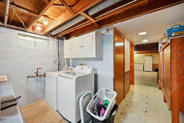 216 N Rauthland Ave, Wapakoneta, OH 45895 - clothes washing area with cabinet space and independent washer and dryer