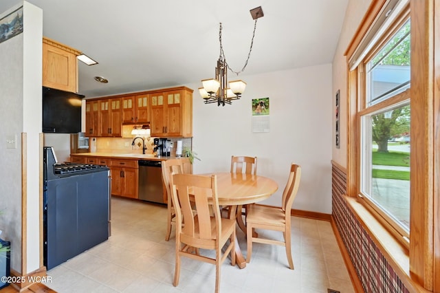 216 N Rauthland Ave, Wapakoneta, OH 45895 - dining area featuring a chandelier and baseboards
