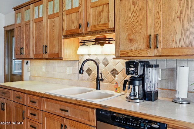 216 N Rauthland Ave, Wapakoneta, OH 45895 - kitchen featuring a sink, dishwasher, light countertops, and tasteful backsplash