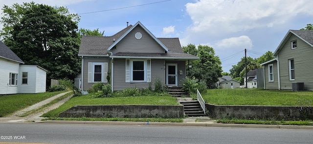 510 N Spruce St, Saint Marys, OH 45885 - view of front of property with a front yard, dirt driveway, and roof with shingles