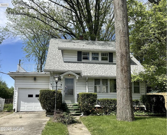 120 S Woodlawn Ave, Lima, OH 45805 - view of front of property featuring a garage, concrete driveway, a chimney, and roof with shingles