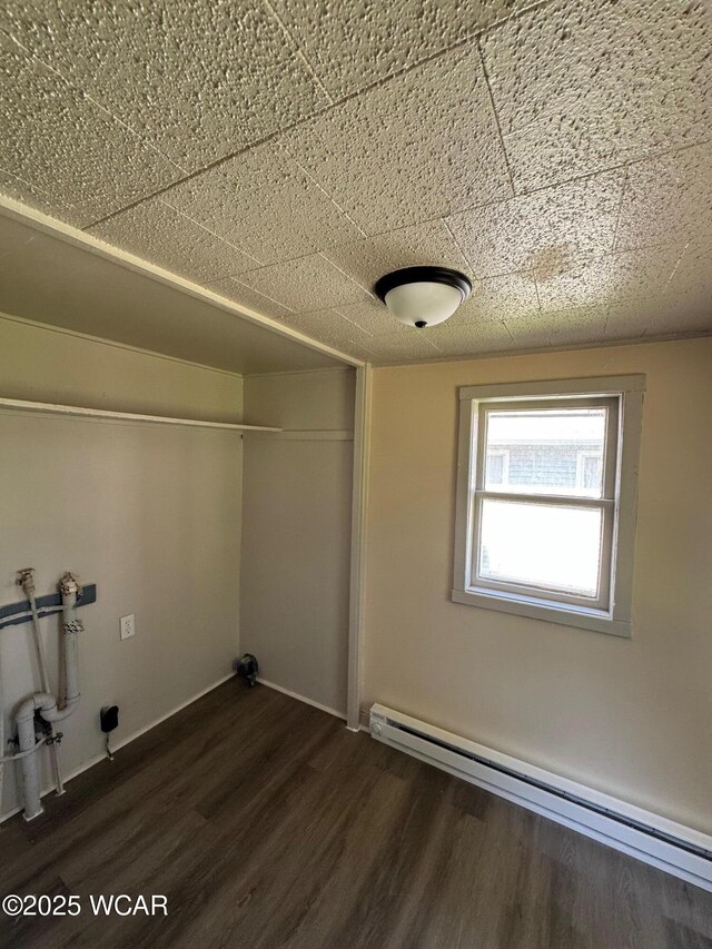 809 King St, Kenton, OH 43326 - laundry room with baseboard heating, washer hookup, and dark wood-type flooring