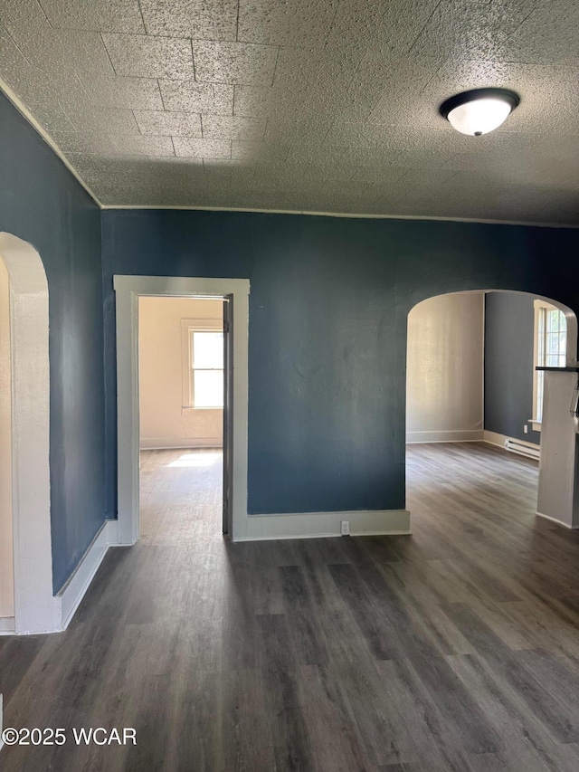 809 King St, Kenton, OH 43326 - unfurnished room with arched walkways and wood finished floors