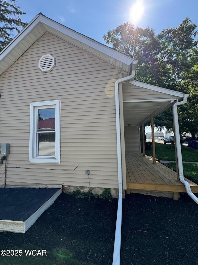 809 King St, Kenton, OH 43326 - view of property exterior with a wooden deck and an attached carport