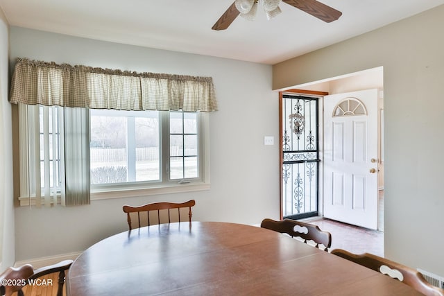 dining room with ceiling fan and visible vents