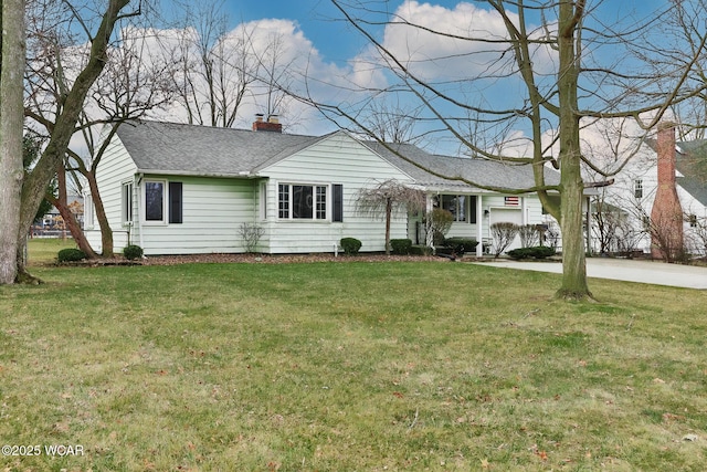 single story home featuring a front lawn, a chimney, and a shingled roof