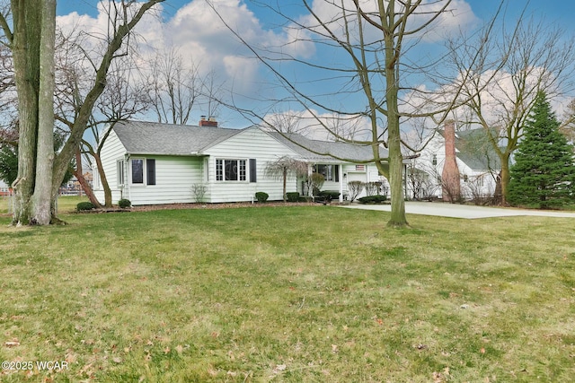 ranch-style house featuring driveway, a front lawn, a chimney, and a shingled roof