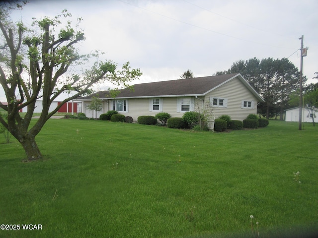 view of side of property featuring a lawn