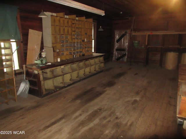 below grade area with wood walls and wood finished floors