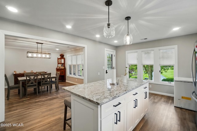 2635 Adgate Rd Unit 1D # 210, Lima, OH 45805 - kitchen featuring white cabinetry, dark wood finished floors, light stone countertops, refrigerator, and hanging light fixtures