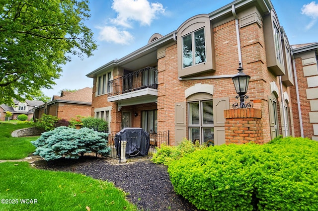 2635 Adgate Rd Unit 1D # 210, Lima, OH 45805 - view of front facade with a balcony and brick siding