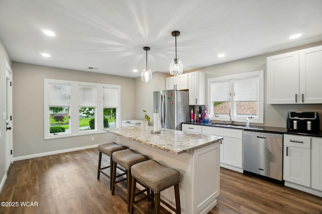 2635 Adgate Rd Unit 1D # 210, Lima, OH 45805 - kitchen featuring appliances with stainless steel finishes, a sink, a breakfast bar, plenty of natural light, and recessed lighting