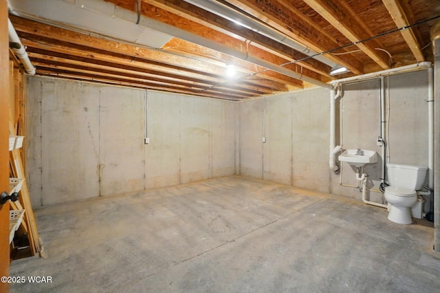 unfinished below grade area with a sink