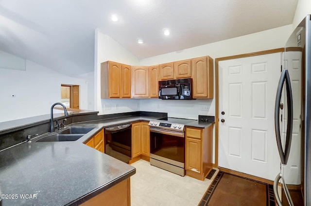 kitchen featuring recessed lighting, lofted ceiling, dark countertops, a sink, and black appliances
