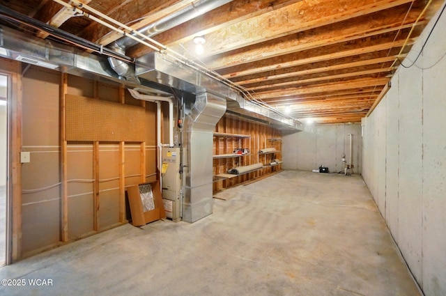 unfinished below grade area featuring heating unit
