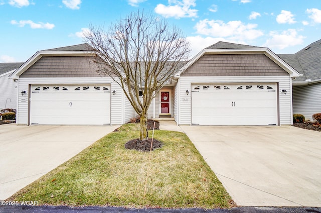 ranch-style home with a garage and a front yard