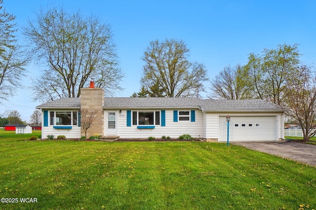 single story home with a front yard, a chimney, aphalt driveway, and a garage