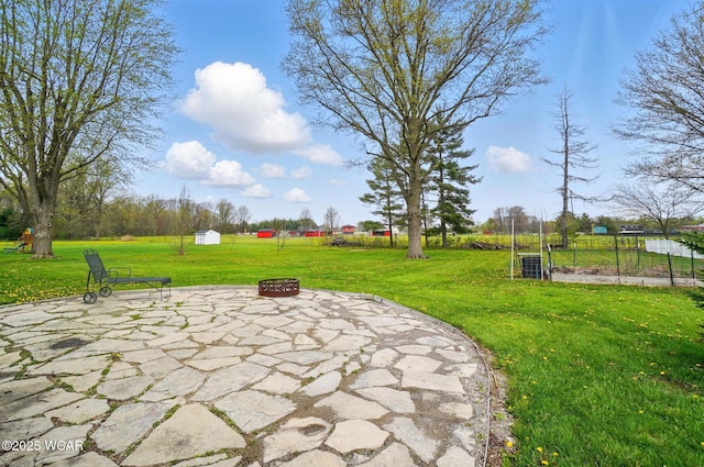 view of patio with an outdoor fire pit