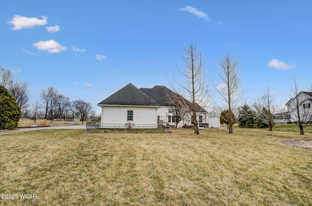 view of property exterior with a lawn