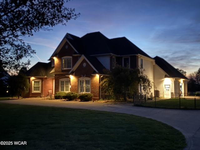 view of front of property with a lawn