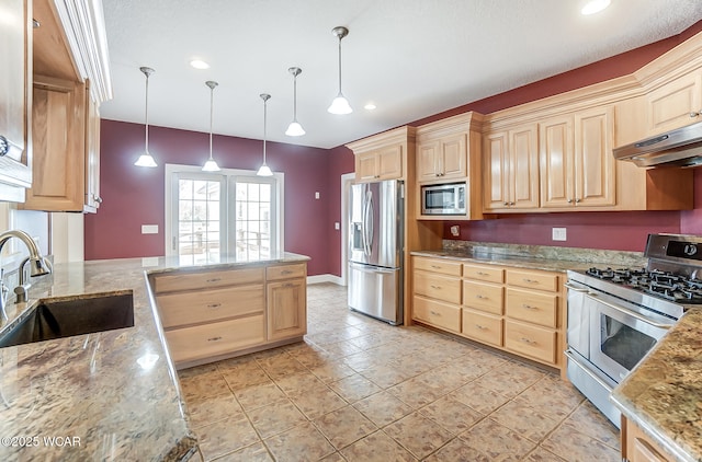 kitchen featuring light brown cabinetry, appliances with stainless steel finishes, a sink, and under cabinet range hood