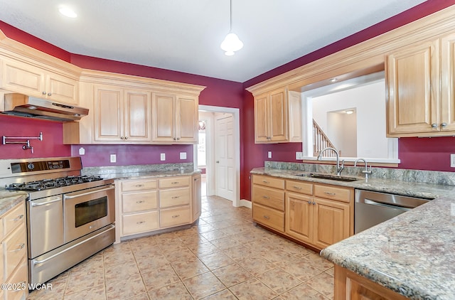 kitchen featuring stainless steel appliances, light brown cabinets, a sink, and under cabinet range hood