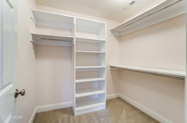 walk in closet with carpet flooring and visible vents