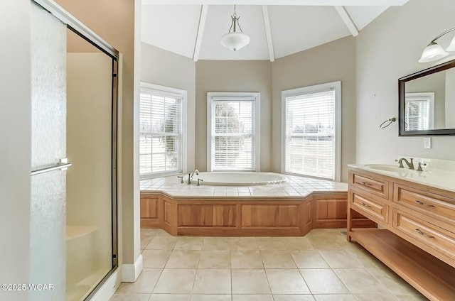 full bathroom with tile patterned floors, vaulted ceiling, vanity, a shower stall, and a bath