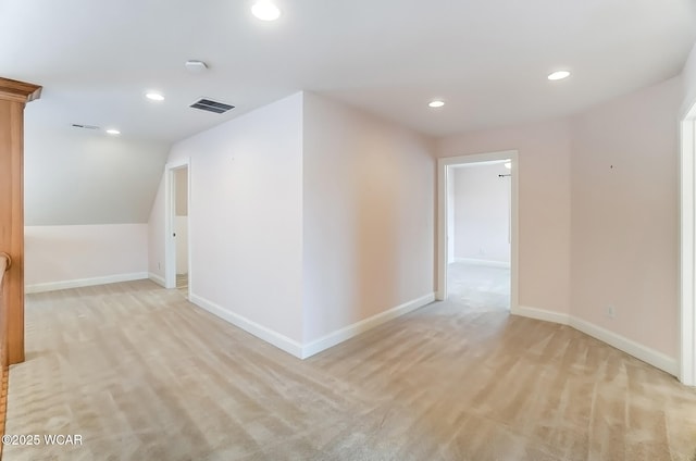 additional living space featuring baseboards, visible vents, and recessed lighting