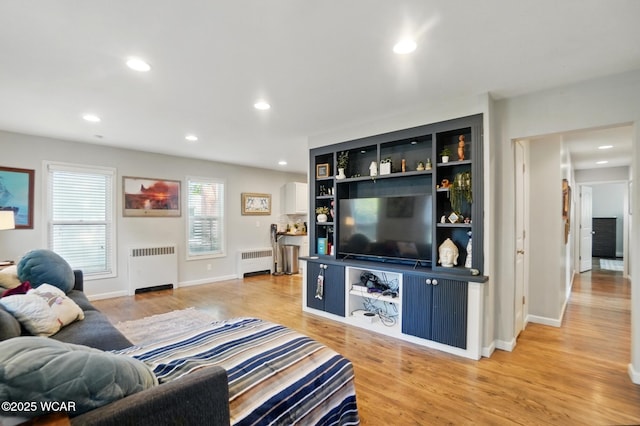 1826 W High St, Lima, OH 45805 - living area featuring radiator, light wood-style floors, recessed lighting, and baseboards