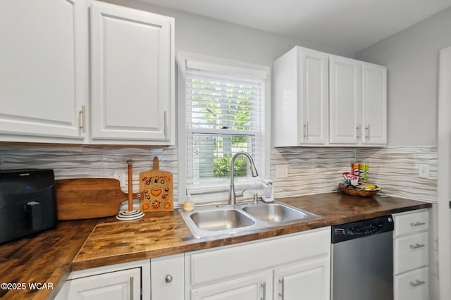 1826 W High St, Lima, OH 45805 - kitchen with dishwasher, a sink, wood counters, and white cabinetry