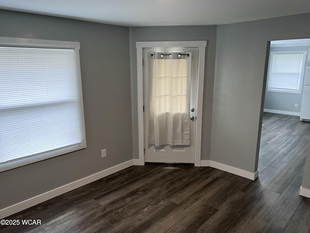 entryway with dark hardwood / wood-style floors